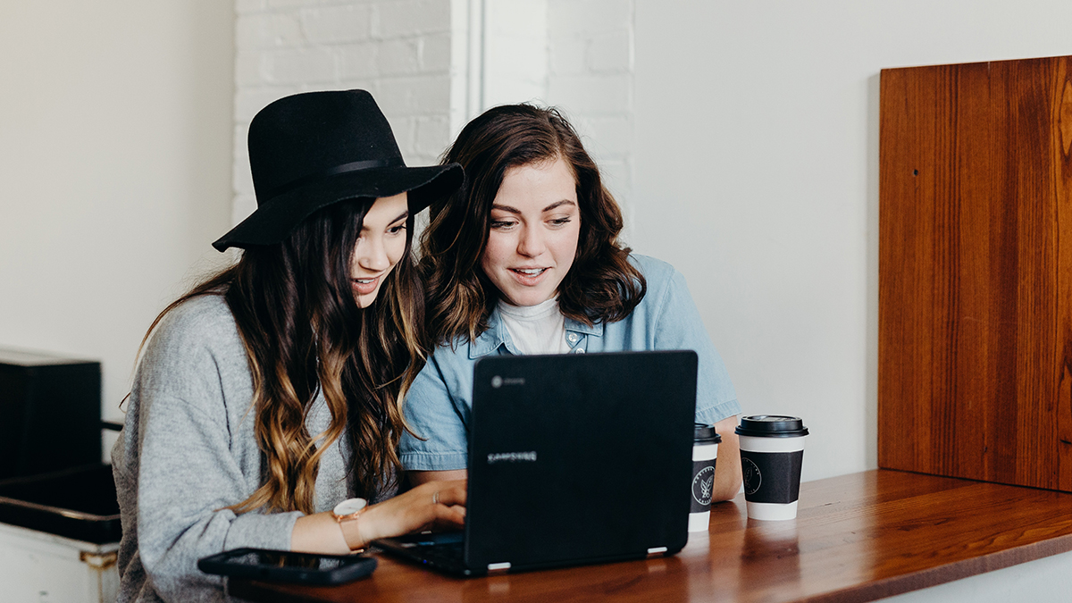 Two girls looking at a laptop
