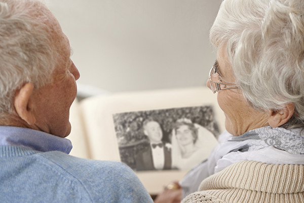Senior citizens viewing photo album