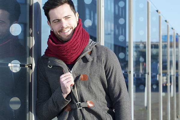 Man wearing jacket and scarf