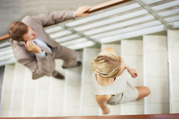 Man and Woman Walking Up Stairs