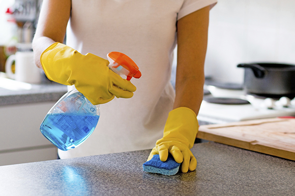 Woman Cleaning Kitchen