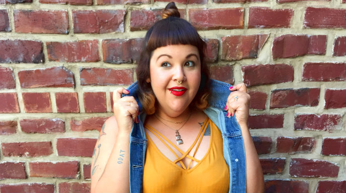 Woman in denim vest and yellow dress Mamafierce plus size fashion blogger