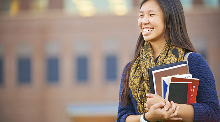 Student holding books