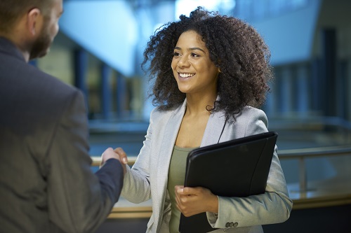 Young woman shaking hands after an interview