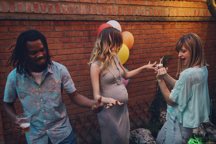 Friends dancing in the backyard