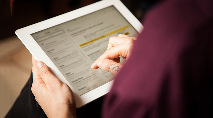 Woman checking email on iPad