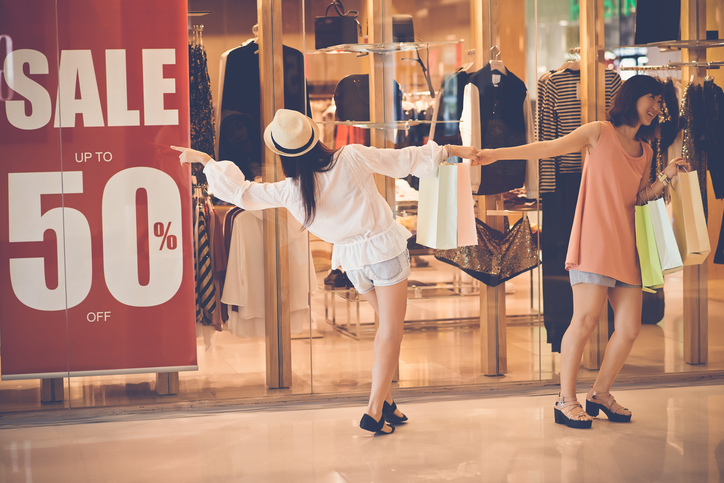 Pair of shoppers going to a big sale