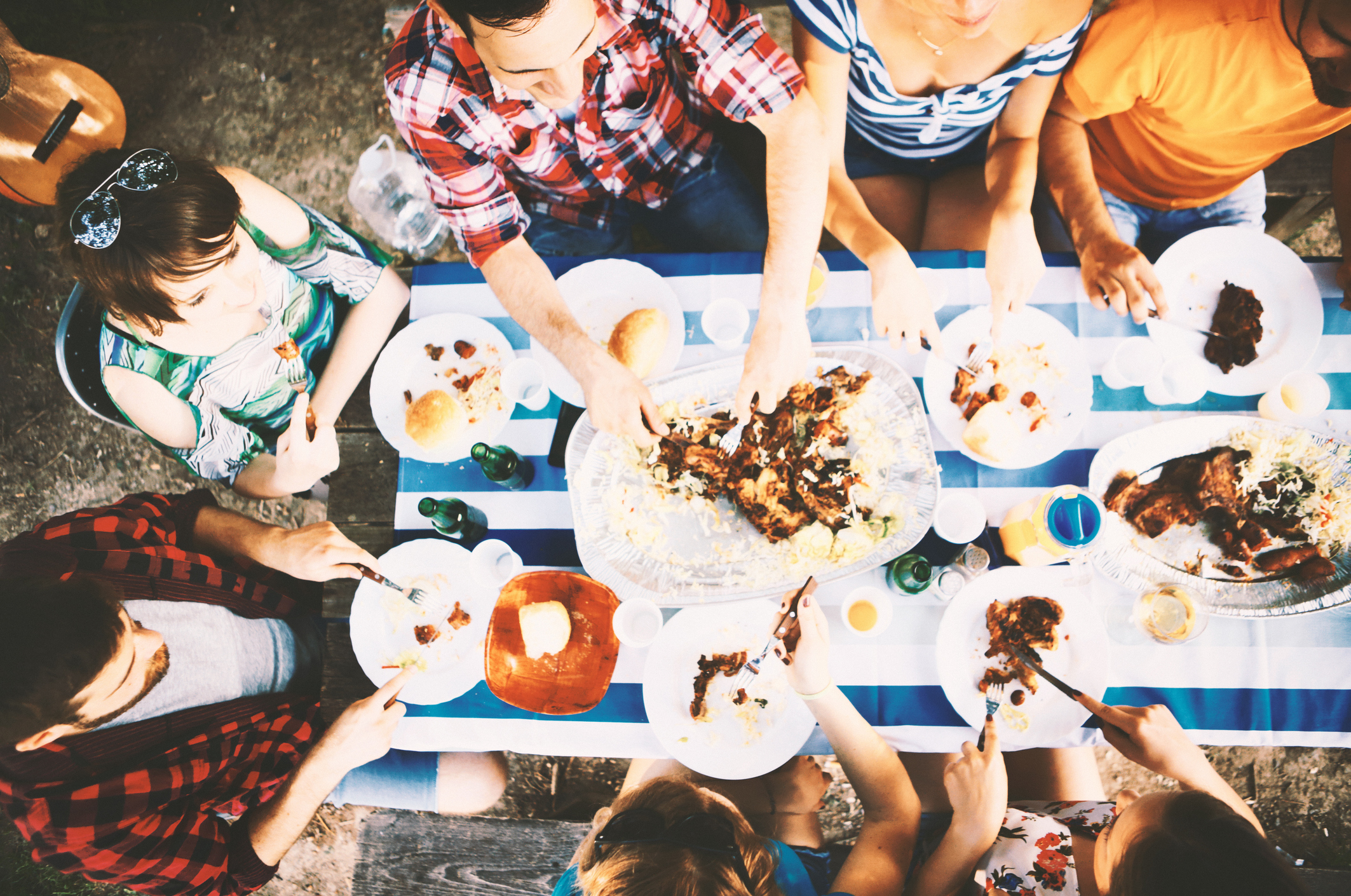 Group of friends having lunch outdoors