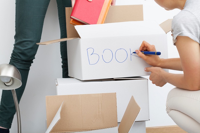 Woman descripting boxes