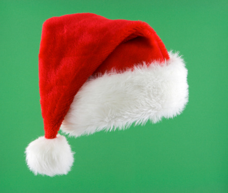 Santa hat on green background