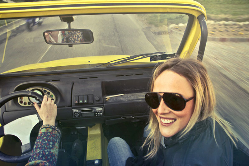Woman smiling in a car