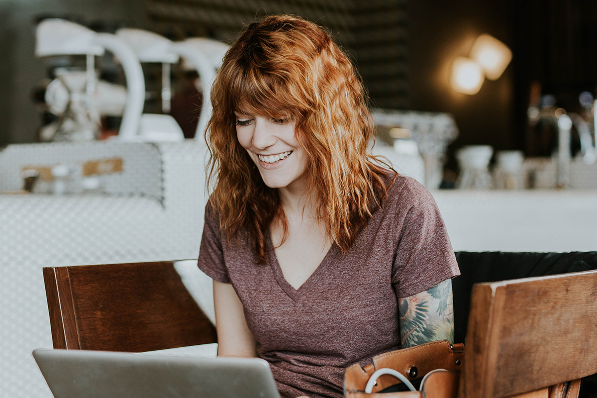 Woman smiling while on laptop