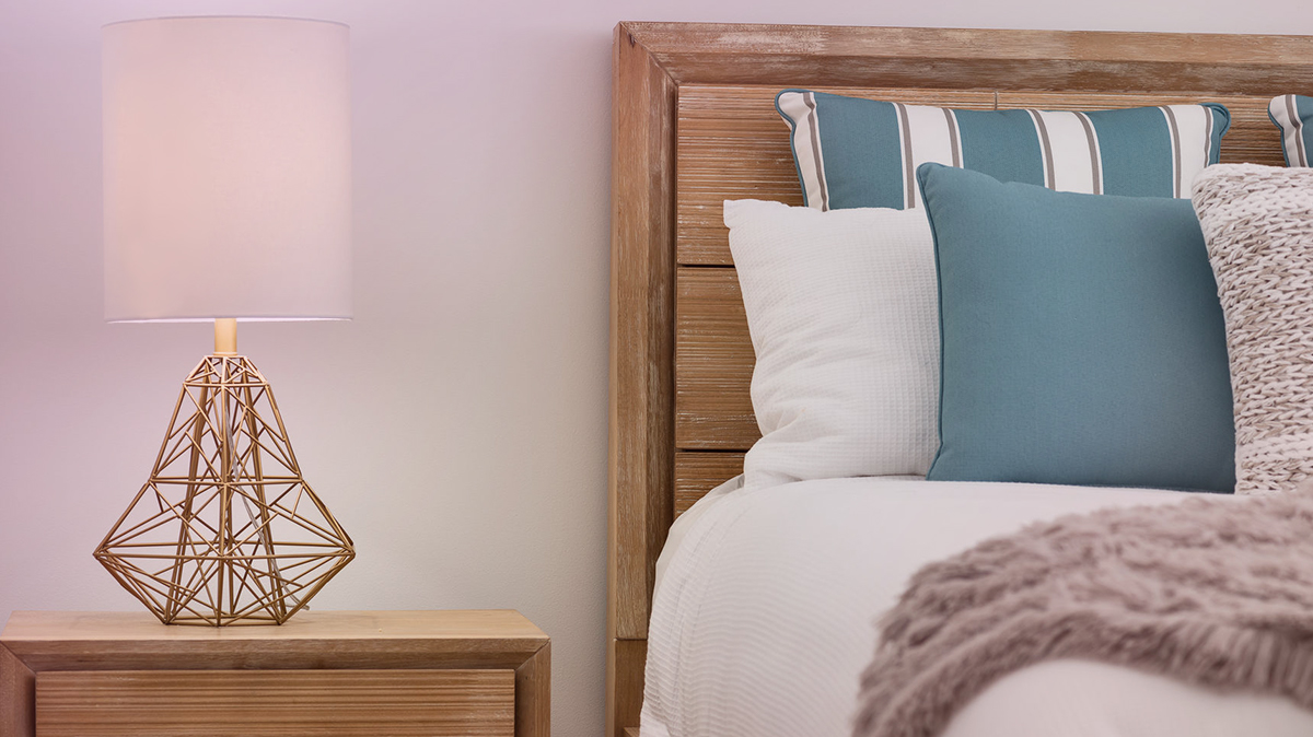 Bed and nightstand with lamp