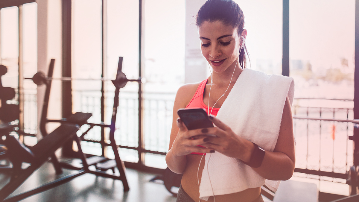 Woman at the gym on her phone