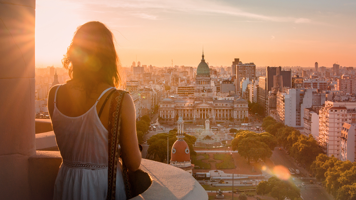 Woman looking out over a city