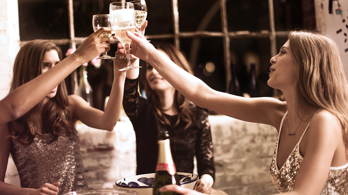 Girls clinking glasses
