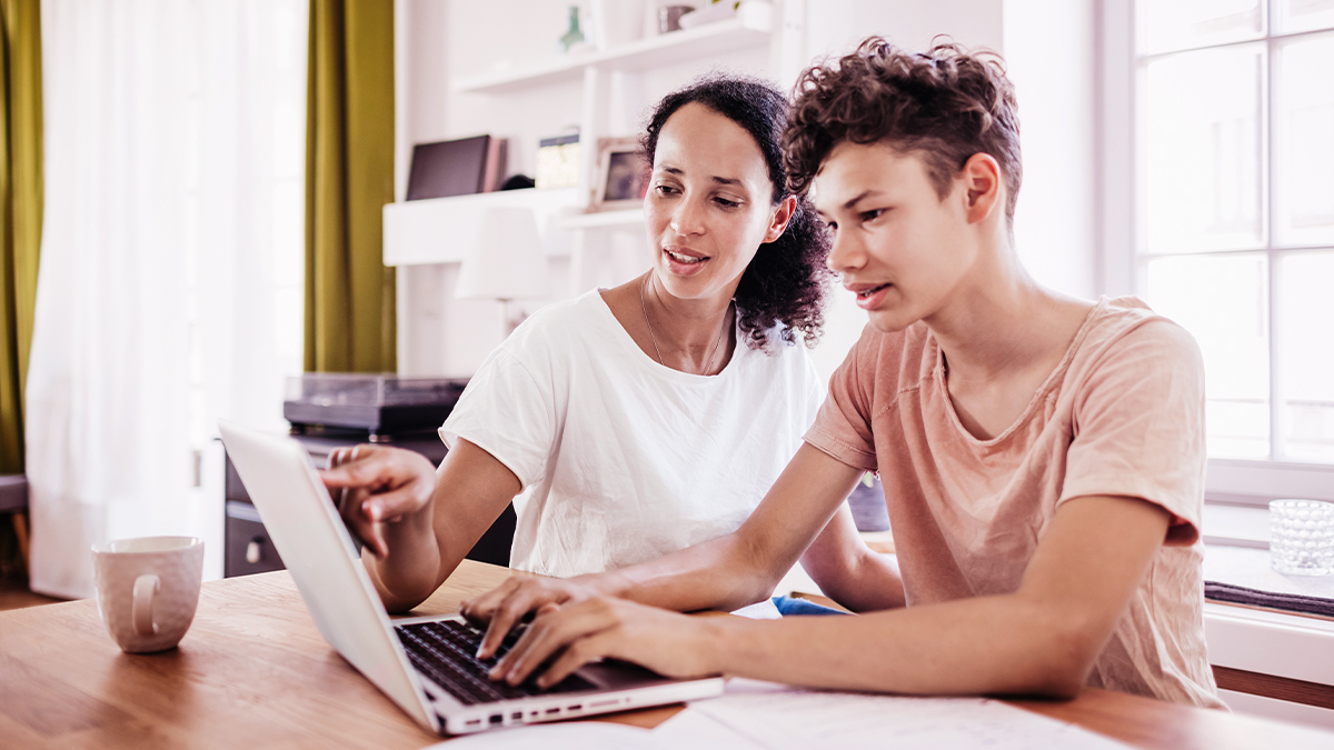 Mom and son on laptop