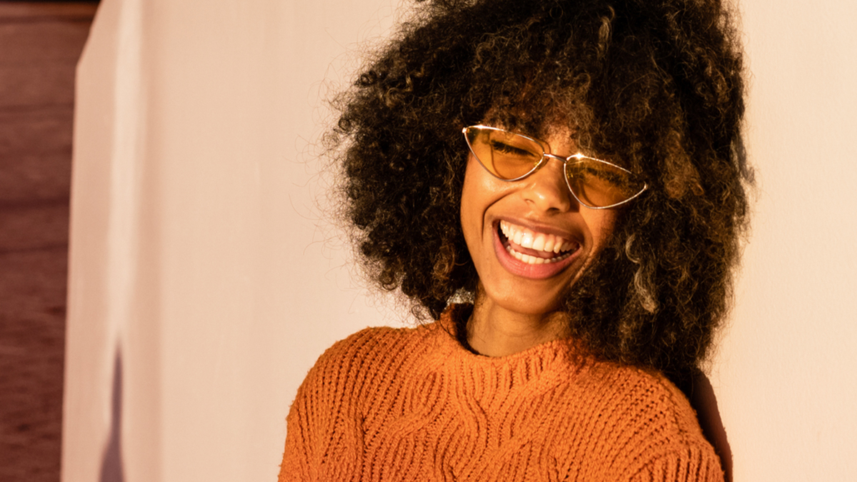 Girl in sunglasses and sweater