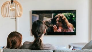 Two people watching TV