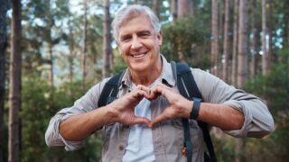 Person making heart shape with hands
