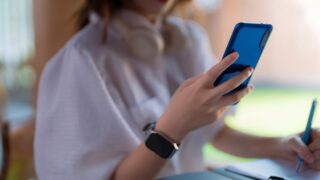 Person using a phone while working