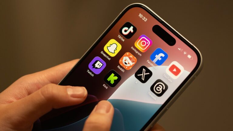 Hands using an iPhone