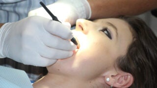 Woman getting a dental exam