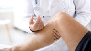 Person getting a knee injection